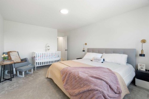 36 Magnolia Bay Se, Calgary, AB - Indoor Photo Showing Bedroom