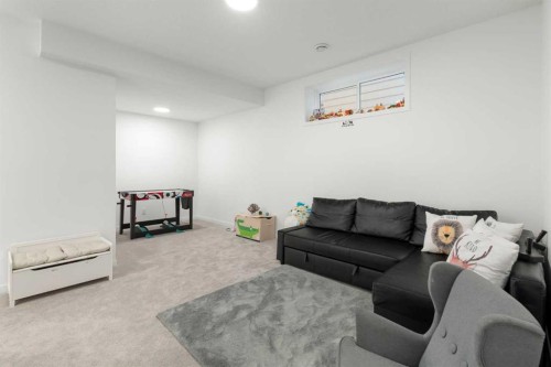 36 Magnolia Bay Se, Calgary, AB - Indoor Photo Showing Living Room