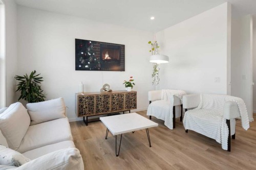36 Magnolia Bay Se, Calgary, AB - Indoor Photo Showing Living Room