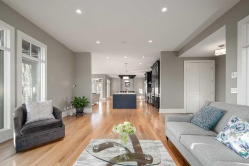 16 Spring Valley Way Sw, Calgary, AB - Indoor Photo Showing Living Room