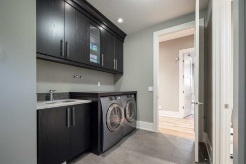 16 Spring Valley Way Sw, Calgary, AB - Indoor Photo Showing Laundry Room