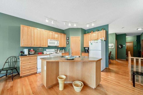 18 Prominence View Sw, Calgary, AB - Indoor Photo Showing Kitchen With Double Sink