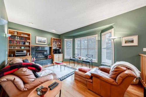 18 Prominence View Sw, Calgary, AB - Indoor Photo Showing Living Room With Fireplace