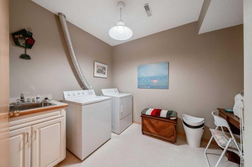 18 Prominence View Sw, Calgary, AB - Indoor Photo Showing Laundry Room