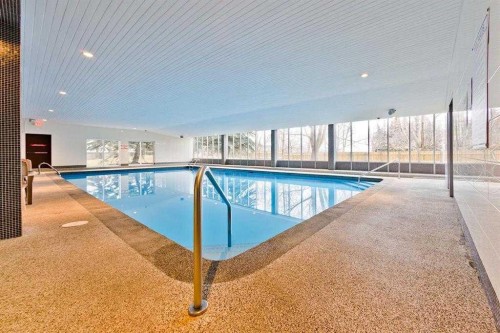 413-4944 Dalton Drive Nw, Calgary, AB -  Photo Showing Other Room With In Ground Pool