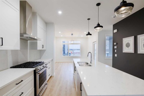 213 Alpine Rush View, Rural Rocky View County, AB - Indoor Photo Showing Kitchen With Double Sink With Upgraded Kitchen