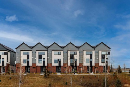 213 Alpine Rush View, Rural Rocky View County, AB - Outdoor With Facade