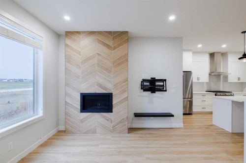 213 Alpine Rush View, Rural Rocky View County, AB - Indoor With Fireplace