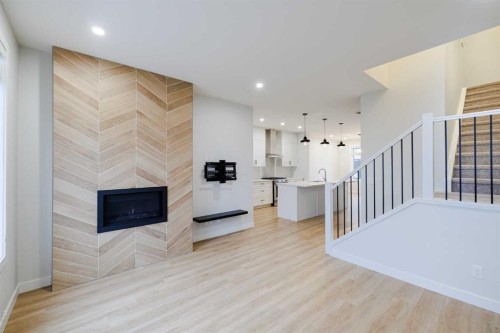 213 Alpine Rush View, Rural Rocky View County, AB - Indoor With Fireplace