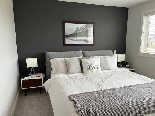 213 Alpine Rush View, Rural Rocky View County, AB - Indoor Photo Showing Bedroom