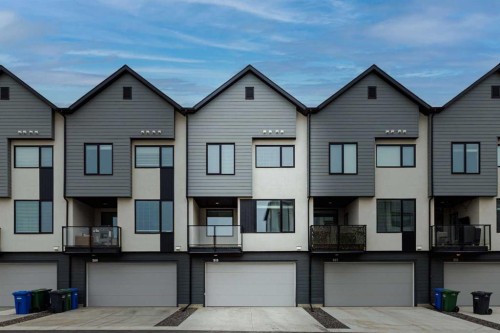 213 Alpine Rush View, Rural Rocky View County, AB - Outdoor With Facade