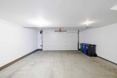 213 Alpine Rush View, Rural Rocky View County, AB - Indoor Photo Showing Garage
