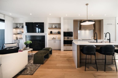 102-1700 73 Street Sw, Calgary, AB - Indoor Photo Showing Kitchen With Fireplace With Upgraded Kitchen