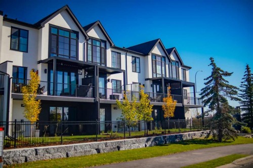 102-1700 73 Street Sw, Calgary, AB - Outdoor With Balcony With Facade