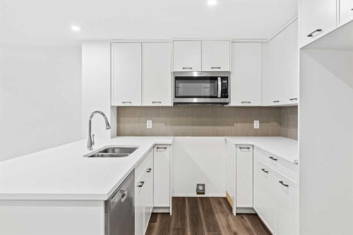 54 Lucas Place Nw, Calgary, AB - Indoor Photo Showing Kitchen With Double Sink