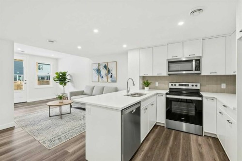 54 Lucas Place Nw, Calgary, AB - Indoor Photo Showing Kitchen With Double Sink
