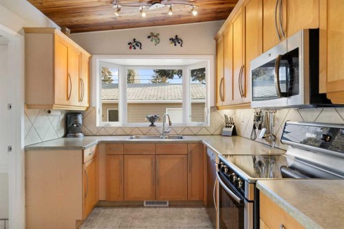 3511 Lakeside Crescent Sw, Calgary, AB - Indoor Photo Showing Kitchen With Double Sink