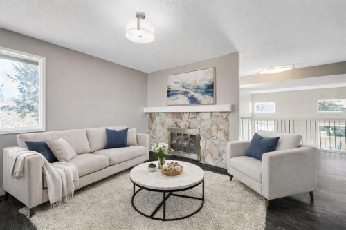 76 Glamis Gardens Sw, Calgary, AB - Indoor Photo Showing Living Room With Fireplace
