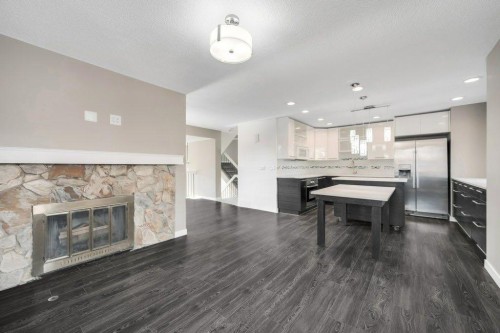 76 Glamis Gardens Sw, Calgary, AB - Indoor With Fireplace