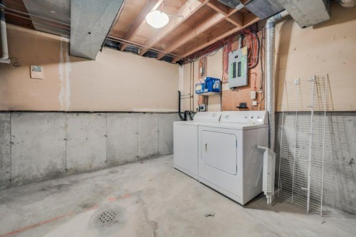 76 Glamis Gardens Sw, Calgary, AB - Indoor Photo Showing Laundry Room