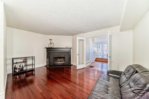 252 21 Avenue Ne, Calgary, AB - Indoor Photo Showing Living Room With Fireplace