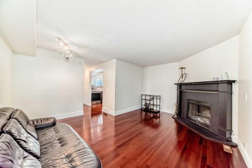 252 21 Avenue Ne, Calgary, AB - Indoor Photo Showing Living Room With Fireplace