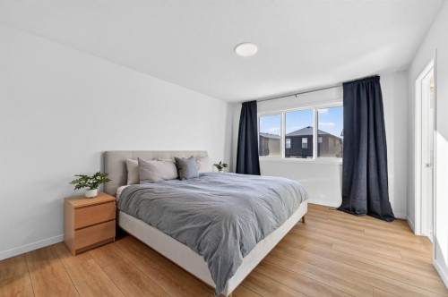 19 Rowley Park Nw, Calgary, AB - Indoor Photo Showing Bedroom