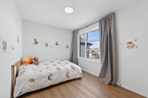 19 Rowley Park Nw, Calgary, AB - Indoor Photo Showing Bedroom