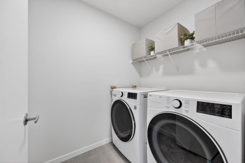 19 Rowley Park Nw, Calgary, AB - Indoor Photo Showing Laundry Room