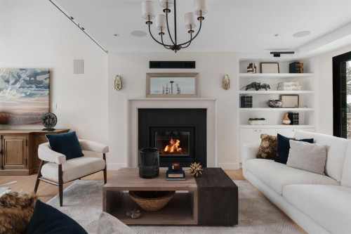 112 Pump Hill Green Sw, Calgary, AB - Indoor Photo Showing Living Room With Fireplace