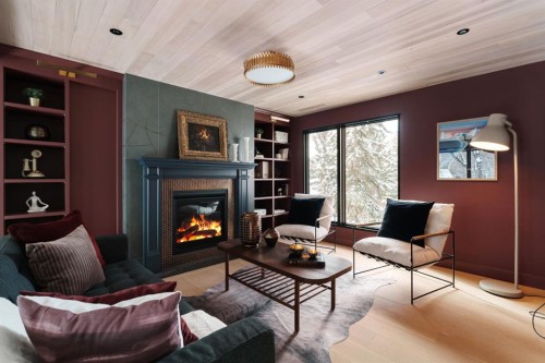 112 Pump Hill Green Sw, Calgary, AB - Indoor Photo Showing Living Room With Fireplace