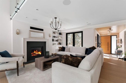 112 Pump Hill Green Sw, Calgary, AB - Indoor Photo Showing Living Room With Fireplace