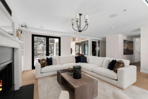 112 Pump Hill Green Sw, Calgary, AB - Indoor Photo Showing Living Room With Fireplace