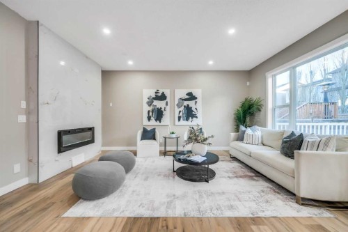 198 Panamount Villas Nw, Calgary, AB - Indoor Photo Showing Living Room With Fireplace