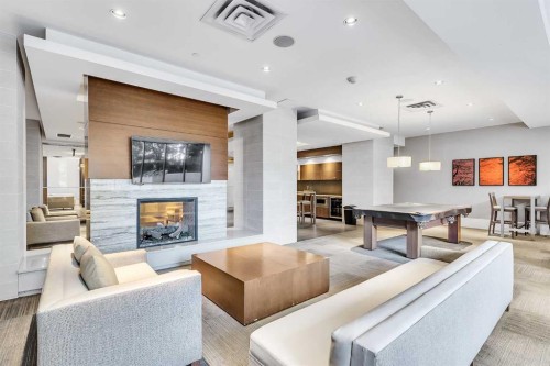 1418-222 Riverfront Avenue Sw, Calgary, AB - Indoor Photo Showing Living Room With Fireplace