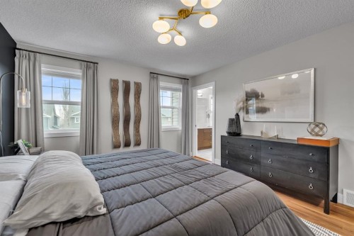 12 Cougar Ridge Manor Sw, Calgary, AB - Indoor Photo Showing Bedroom