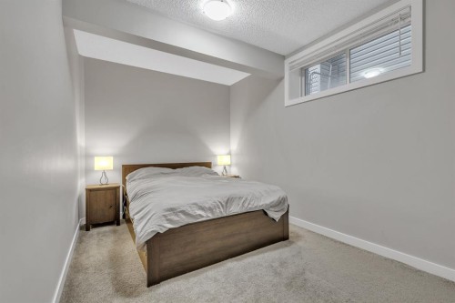 12 Cougar Ridge Manor Sw, Calgary, AB - Indoor Photo Showing Bedroom
