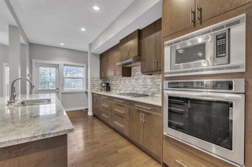 12 Cougar Ridge Manor Sw, Calgary, AB - Indoor Photo Showing Kitchen With Upgraded Kitchen