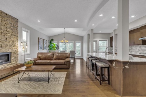 12 Cougar Ridge Manor Sw, Calgary, AB - Indoor Photo Showing Living Room With Fireplace