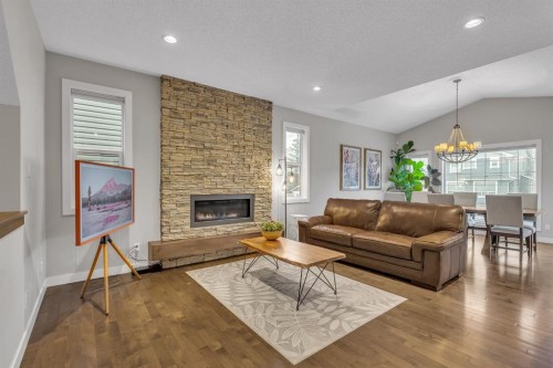 12 Cougar Ridge Manor Sw, Calgary, AB - Indoor Photo Showing Living Room With Fireplace