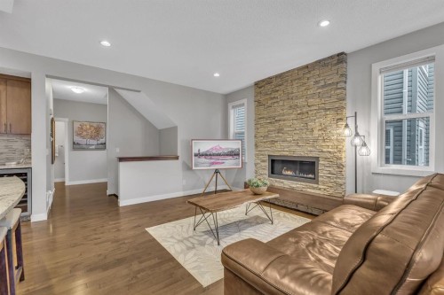 12 Cougar Ridge Manor Sw, Calgary, AB - Indoor Photo Showing Living Room With Fireplace