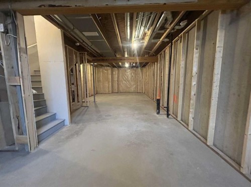 200 Belmont Way Sw, Calgary, AB - Indoor Photo Showing Basement