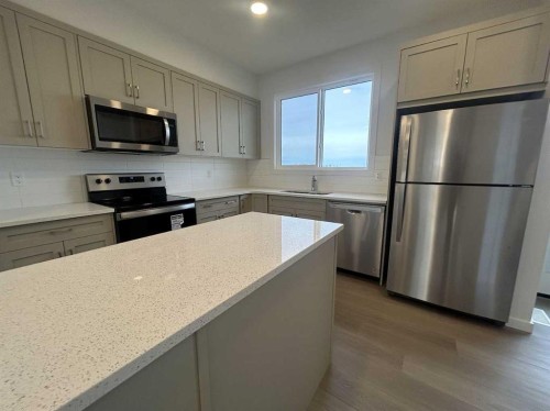 200 Belmont Way Sw, Calgary, AB - Indoor Photo Showing Kitchen With Stainless Steel Kitchen