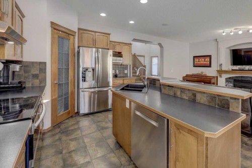 463 Cranfield Gardens Se, Calgary, AB - Indoor Photo Showing Kitchen With Stainless Steel Kitchen With Double Sink