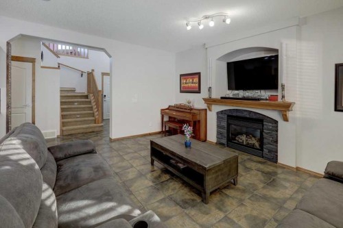 463 Cranfield Gardens Se, Calgary, AB - Indoor Photo Showing Living Room With Fireplace