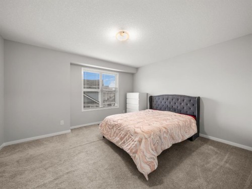 410 Copperstone Manor Se, Calgary, AB - Indoor Photo Showing Bedroom