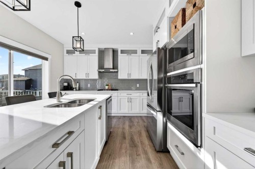 1409 Price Close, Carstairs, AB - Indoor Photo Showing Kitchen With Double Sink With Upgraded Kitchen