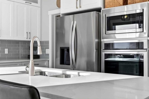 1409 Price Close, Carstairs, AB - Indoor Photo Showing Kitchen With Double Sink With Upgraded Kitchen