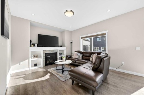 1409 Price Close, Carstairs, AB - Indoor Photo Showing Living Room With Fireplace