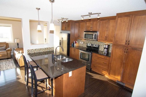2275 Reunion Street Nw, Airdrie, AB - Indoor Photo Showing Kitchen With Double Sink With Upgraded Kitchen